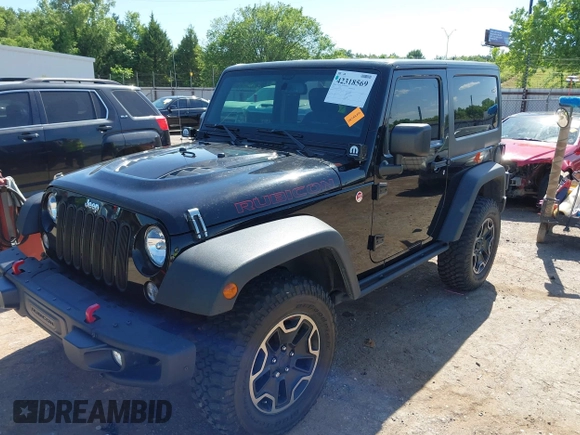 2015 Jeep Wrangler Rubicon Hard Rock with VIN 1C4BJWCG1FL610028, listed as a IAAI auction lot 42318569 with 48,627 mi miles and . Bid and sale history available at DreamBid. Image 2.