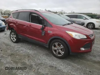 2014 Ford Escape SE with VIN 1FMCU0GXXEUD05991, listed as a Copart auction lot 51440465 with 129,445 mi miles and Salvage Title. Bid and sale history available at carsss.com. Image 4.