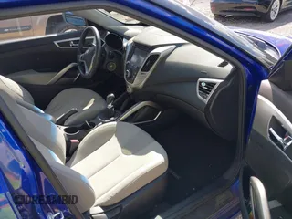 2012 Hyundai Veloster w/Gray Int z VIN KMHTC6AD3CU074501, wystawiony jako IAAI lot #42289456 z przebiegiem 94 303 mil mil oraz . Historia ofert i sprzedaży dostępna na DreamBid. Obrazek 5.