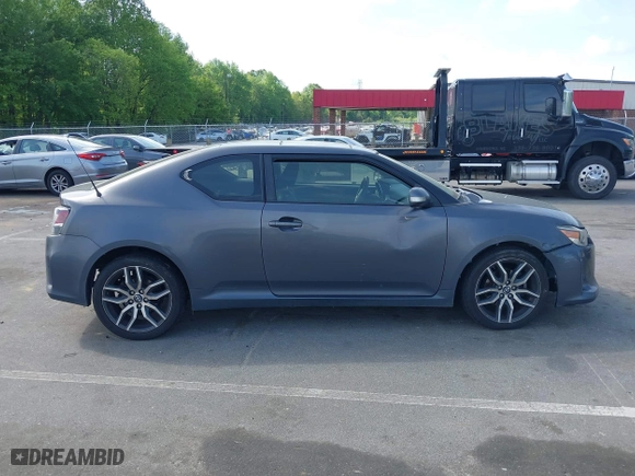2015 Scion tC with VIN JTKJF5C71FJ013747, listed as a IAAI auction lot 42087740 with 138,097 mi miles. Bid and sale history available at carsss.com. Image 13.