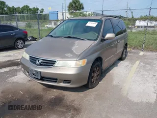 2004 Honda Odyssey EX-L z VIN 5FNRL18954B014748, wystawiony jako IAAI lot #42389048 z przebiegiem 136 176 mil mil oraz . Historia ofert i sprzedaży dostępna na DreamBid. Obrazek 2.