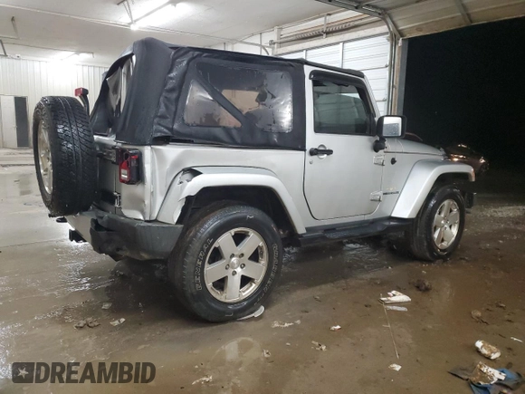 2009 Jeep Wrangler Sahara z VIN 1J4FA54189L789642, wystawiony jako Copart lot #89078145 z przebiegiem 128 902 mil mil oraz Szkoda całkowita • Salvage title. Historia ofert i sprzedaży dostępna na DreamBid. Obrazek 3.