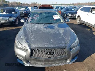 2015 Infiniti Q50 Premium z VIN JN1BV7AR2FM423666, wystawiony jako IAAI lot #41345228 z przebiegiem 67 027 mil mil oraz . Historia ofert i sprzedaży dostępna na DreamBid. Obrazek 12.
