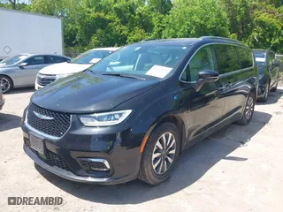 2021 Chrysler Pacifica Hybrid Touring L with VIN 2C4RC1L73MR599629, listed as a IAAI auction lot 42013823 with 62,886 mi miles. Bid and sale history available at carsss.com. Image 17.