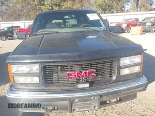 1999 GMC Suburban with VIN 3GKEC16R6XG549656, listed as a IAAI auction lot 41403259 with 306,548 mi miles. Bid and sale history available at carsss.com. Image 6.