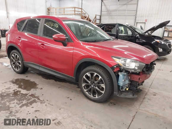 2016 Mazda CX-5 Grand Touring with VIN JM3KE4DY7G0731057, listed as a IAAI auction lot 41118072 with 134,107 mi miles and . Bid and sale history available at carsss.com. Image 1.