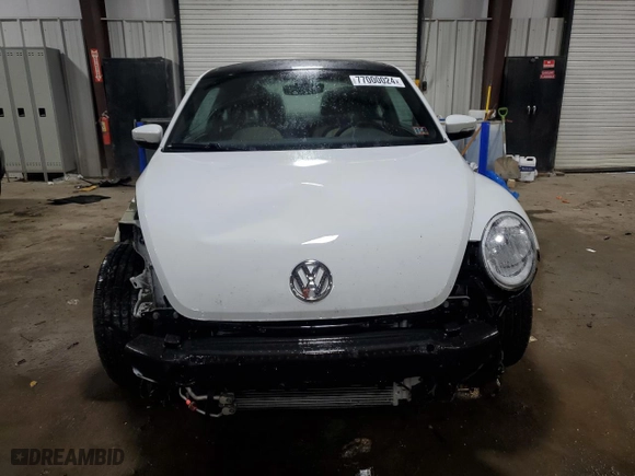 2019 Volkswagen Beetle S with VIN 3VWFD7AT4KM703324, listed as a Copart auction lot 77000024 with 93,346 mi miles and Salvage Title. Bid and sale history available at carsss.com. Image 5.