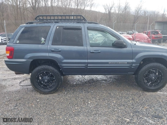 2003 Jeep Grand Cherokee Limited with VIN 1J4GW58N43C521617, listed as a IAAI auction lot 41781064 with 228,086 mi miles. Bid and sale history available at carsss.com. Image 13.