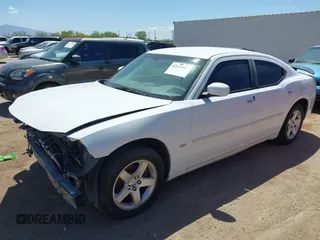 2010 Dodge Charger SXT with VIN 2B3CA3CV5AH297994, listed as a IAAI auction lot 42153457 with 157,017 mi miles. Bid and sale history available at carsss.com. Image 2.
