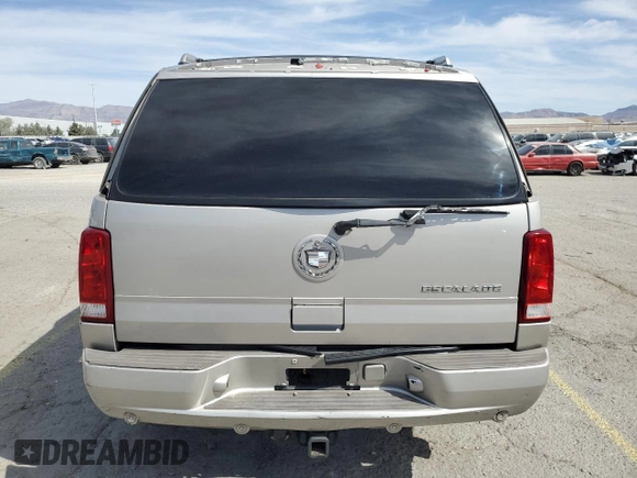 2004 Cadillac Escalade z VIN 1GYEC63T44R235759, wystawiony jako Copart lot #53166755 z przebiegiem 212 034 mil mil oraz Szkody całkowita. Historia ofert i sprzedaży dostępna na DreamBid. Obrazek 6.