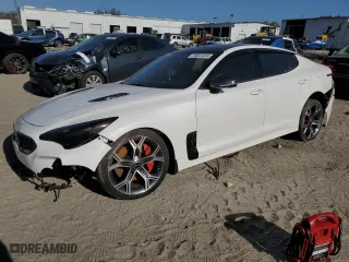 2021 Kia Stinger GT2 with VIN KNAE55LC1M6089121, listed as a Copart auction lot 74823434 with 25,009 mi miles and Salvage Title. Bid and sale history available at carsss.com. Image 1.