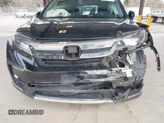 2021 Honda Pilot Elite with VIN 5FNYF6H04MB043014, listed as a IAAI auction lot 41826931 with 63,546 mi miles and . Bid and sale history available at DreamBid. Image 6.