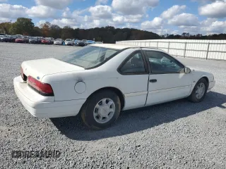 1993 Ford Thunderbird LX z VIN 1FAPP62T6PH189176, wystawiony jako Copart lot #78146094 z przebiegiem 107 514 mil mil oraz Szkoda całkowita • Salvage title. Historia ofert i sprzedaży dostępna na DreamBid. Obrazek 3.