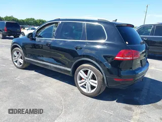2013 Volkswagen Touareg Lux with VIN WVGEF9BP6DD004454, listed as a IAAI auction lot 41862958 with 239,548 mi miles and . Bid and sale history available at DreamBid. Image 3.