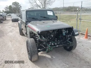 2022 Jeep Gladiator Texas Trail z VIN 1C6HJTAG0NL162804, wystawiony jako IAAI lot #41524087 z przebiegiem 17 652 mil mil oraz . Historia ofert i sprzedaży dostępna na DreamBid. Obrazek 6.
