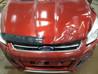2016 Ford Escape Titanium with VIN 1FMCU9J95GUC57205, listed as a Copart auction lot 71033934 with 90,477 mi miles and Salvage Title. Bid and sale history available at DreamBid. Image 12.