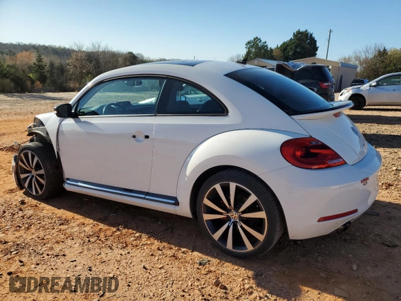 2012 Volkswagen Beetle 2.0T Turbo w/Sun/Snd/Nav PZEV with VIN 3VWVA7AT9CM656846, listed as a Copart auction lot 49466825 with 76,362 mi miles and Salvage Title. Bid and sale history available at carsss.com. Image 2.