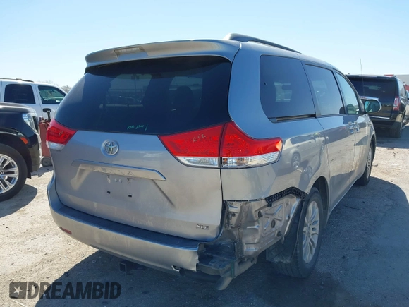 2011 Toyota Sienna XLE AAS with VIN 5TDYK3DCXBS172586, listed as a IAAI auction lot 41835992 with 203,599 mi miles. Bid and sale history available at carsss.com. Image 4.