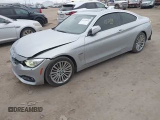 2014 BMW 4 Series 428i xDrive with VIN WBA3N5C53EF716542, listed as a IAAI auction lot 41157641 with 135,264 mi miles and . Bid and sale history available at DreamBid. Image 2.