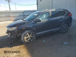 2018 Honda CR-V Touring with VIN 2HKRW1H94JH507406, listed as a Copart auction lot 86980214 with 76,527 mi miles and Salvage Title. Bid and sale history available at carsss.com. Image 1.