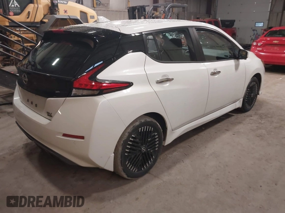 2023 Nissan LEAF SV Plus z VIN 1N4CZ1CV0PC563256, wystawiony jako IAAI lot #41138436 z przebiegiem 24 399 mil mil oraz . Historia ofert i sprzedaży dostępna na DreamBid. Obrazek 4.