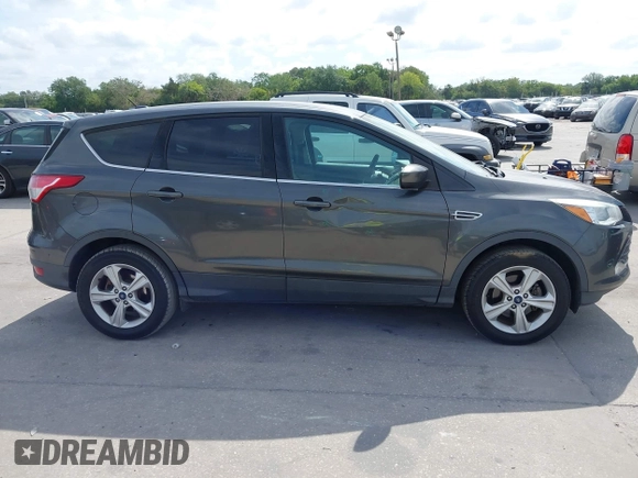2015 Ford Escape SE with VIN 1FMCU0G7XFUA89965, listed as a IAAI auction lot 42072553 with 129,877 mi miles. Bid and sale history available at carsss.com. Image 13.