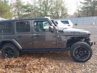 2021 Jeep Wrangler Unlimited Sport S with VIN 1C4HJXDN4MW518307, listed as a IAAI auction lot 41222996 with 39,499 mi miles and . Bid and sale history available at DreamBid. Image 13.
