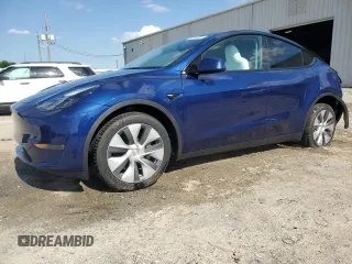 2023 Tesla Model Y Long Range z VIN 7SAYGDEE3PA178832, wystawiony jako Copart lot #57156005 z przebiegiem 12 920 mil mil oraz Szkody całkowita. Historia ofert i sprzedaży dostępna na DreamBid. Obrazek 1.