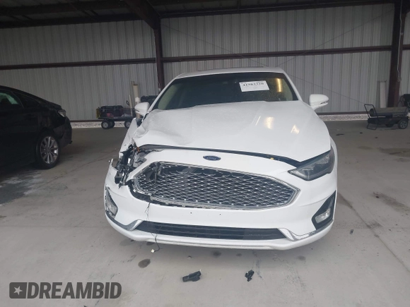 2019 Ford Fusion Titanium with VIN 3FA6P0K95KR271291, listed as a IAAI auction lot 41983320 with 71,962 mi miles and . Bid and sale history available at DreamBid. Image 12.