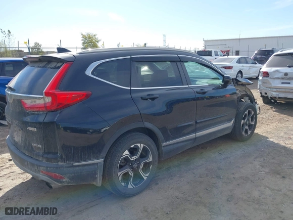 2017 Honda CR-V Touring with VIN 5J6RW2H96HL037854, listed as a IAAI auction lot 40472748 with 126,582 mi miles. Bid and sale history available at carsss.com. Image 4.