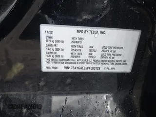 2023 Tesla Model Y Long Range z VIN 7SAYGAEE5PF603128, wystawiony jako IAAI lot #41328797 z przebiegiem 63 527 mil mil oraz . Historia ofert i sprzedaży dostępna na DreamBid. Obrazek 9.