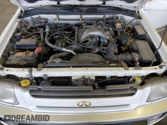 2000 Infiniti QX4 z VIN JNRAR07Y3YW084474, wystawiony jako Copart lot #87089994 z przebiegiem 237 974 mil mil oraz Szkody całkowita. Historia ofert i sprzedaży dostępna na DreamBid. Obrazek 13.
