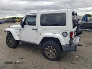 2013 Jeep Wrangler Sahara with VIN 1C4AJWBG8DL691619, listed as a Copart auction lot 56194275 with 103,299 mi miles and Salvage title. Bid and sale history available at DreamBid. Image 2.