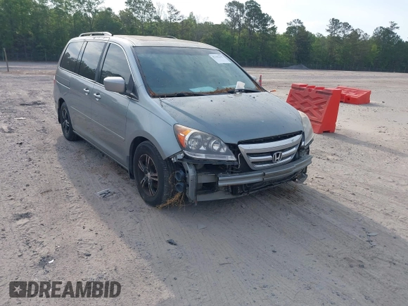 2005 Honda Odyssey TOURING with VIN 5FNRL38815B027811, listed as a IAAI auction lot 42105642 with 303,913 mi miles. Bid and sale history available at carsss.com. Image 1.