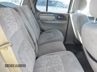 2004 GMC Envoy SLE with VIN 1GKDT13S642213710, listed as a IAAI auction lot 41680656 with 239,187 mi miles. Bid and sale history available at carsss.com. Image 8.