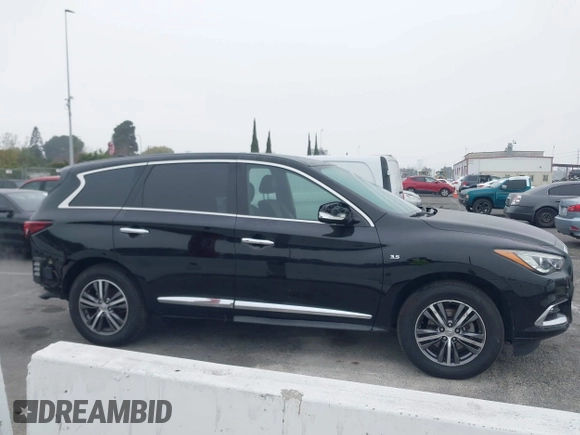 2019 Infiniti QX60 LUXE with VIN 5N1DL0MN7KC500202, listed as a IAAI auction lot 41229623 with 103,626 mi miles. Bid and sale history available at carsss.com. Image 14.