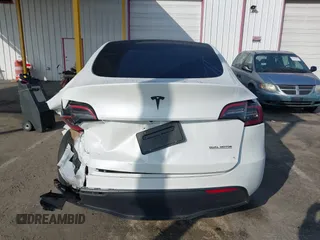 2023 Tesla Model Y Long Range with VIN 7SAYGAEE7PF766735, listed as a IAAI auction lot 41626651 with 21,983 mi miles. Bid and sale history available at carsss.com. Image 17.