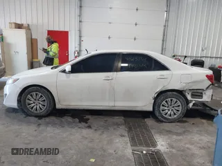 2014 Toyota Camry L with VIN 4T1BF1FK4EU763009, listed as a IAAI auction lot 41615134 with 165,293 mi miles and . Bid and sale history available at carsss.com. Image 14.