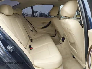 2014 BMW 3 Series 328i with VIN WBA3C1C56EK108665, listed as a IAAI auction lot 42101319 with 84,928 mi miles and . Bid and sale history available at DreamBid. Image 8.