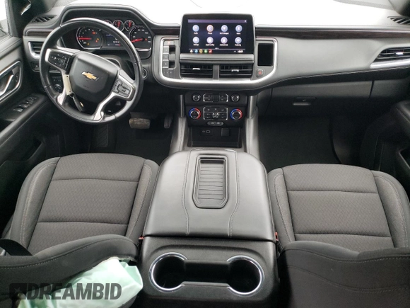 2021 Chevrolet Suburban LS with VIN 1GNSCBKD5MR392512, listed as a Copart auction lot 71238124 with 77,775 mi miles and Salvage Title. Bid and sale history available at DreamBid. Image 8.