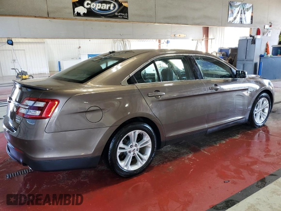 2015 Ford Taurus SEL with VIN 1FAHP2E94FG157022, listed as a Copart auction lot 74569614 with 133,223 mi miles and Salvage Title. Bid and sale history available at DreamBid. Image 3.