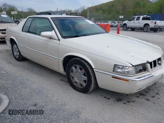 1997 Cadillac Eldorado Touring with VIN 1G6ET1293VU604921, listed as a IAAI auction lot 42113040 with 57,029 mi miles and . Bid and sale history available at DreamBid. Image 1.