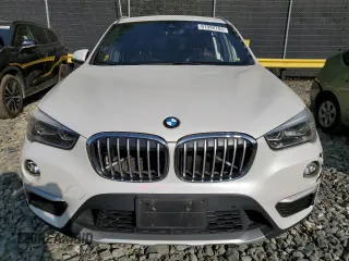 2017 BMW X1 xDrive28i with VIN WBXHT3C33H5F70208, listed as a Copart auction lot 67999764 with 130,341 mi miles and Salvage Title. Bid and sale history available at carsss.com. Image 5.