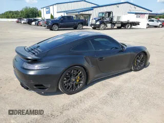 2014 Porsche 911 Turbo with VIN WP0AD2A90ES167116, listed as a Copart auction lot 69284504 with 67,701 mi miles and Salvage Title. Bid and sale history available at carsss.com. Image 3.