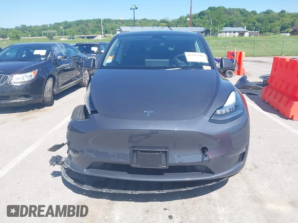 2023 Tesla Model Y Long Range with VIN 7SAYGDEE4PA037218, listed as a IAAI auction lot 42232704 with 18,756 mi miles and . Bid and sale history available at DreamBid. Image 13.