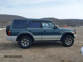 1995 Mitsubishi Montero z VIN JA4MR41H7SJ010597, wystawiony jako IAAI lot #41610885 z przebiegiem 162 406 mil mil oraz . Historia ofert i sprzedaży dostępna na DreamBid. Obrazek 13.