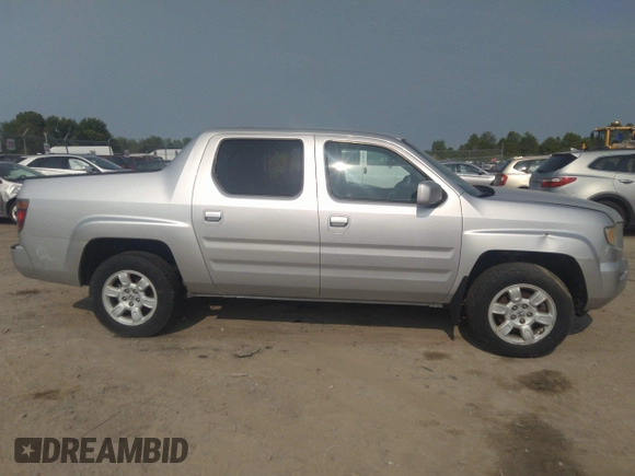 2007 Honda Ridgeline RTL z VIN 2HJYK16537H501200, wystawiony jako IAAI lot #42425662 z przebiegiem 188 618 mil mil oraz . Historia ofert i sprzedaży dostępna na DreamBid. Obrazek 14.