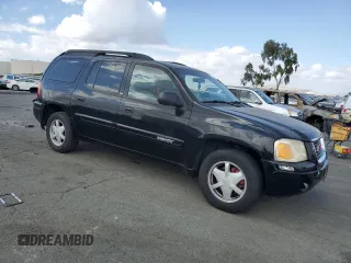 2003 GMC Envoy SLT with VIN 1GKES16SX36220489, listed as a Copart auction lot 71859834 with 148,811 mi miles and Salvage Title. Bid and sale history available at DreamBid. Image 4.