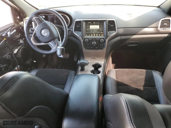 2015 Jeep Grand Cherokee Laredo with VIN 1C4RJFAG0FC720473, listed as a Copart auction lot 50018345 with 104,161 mi miles and Salvage Title. Bid and sale history available at carsss.com. Image 8.