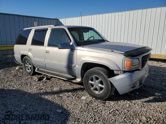 1999 GMC Denali z VIN 1GKEK13R4XR918005, wystawiony jako Copart lot #74964184 z przebiegiem 206 584 mil mil oraz Nie do naprawy. Historia ofert i sprzedaży dostępna na DreamBid. Obrazek 4.